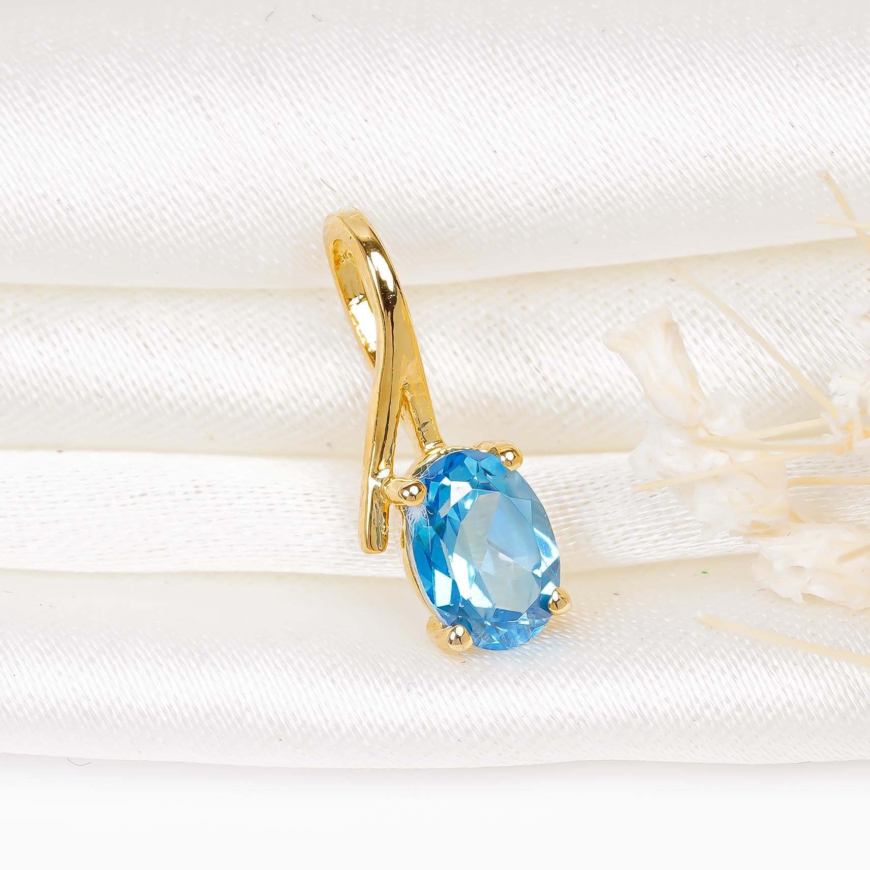 Swiss Blue Topaz Pendant Necklace: Oval Sterling Silver Birthstone