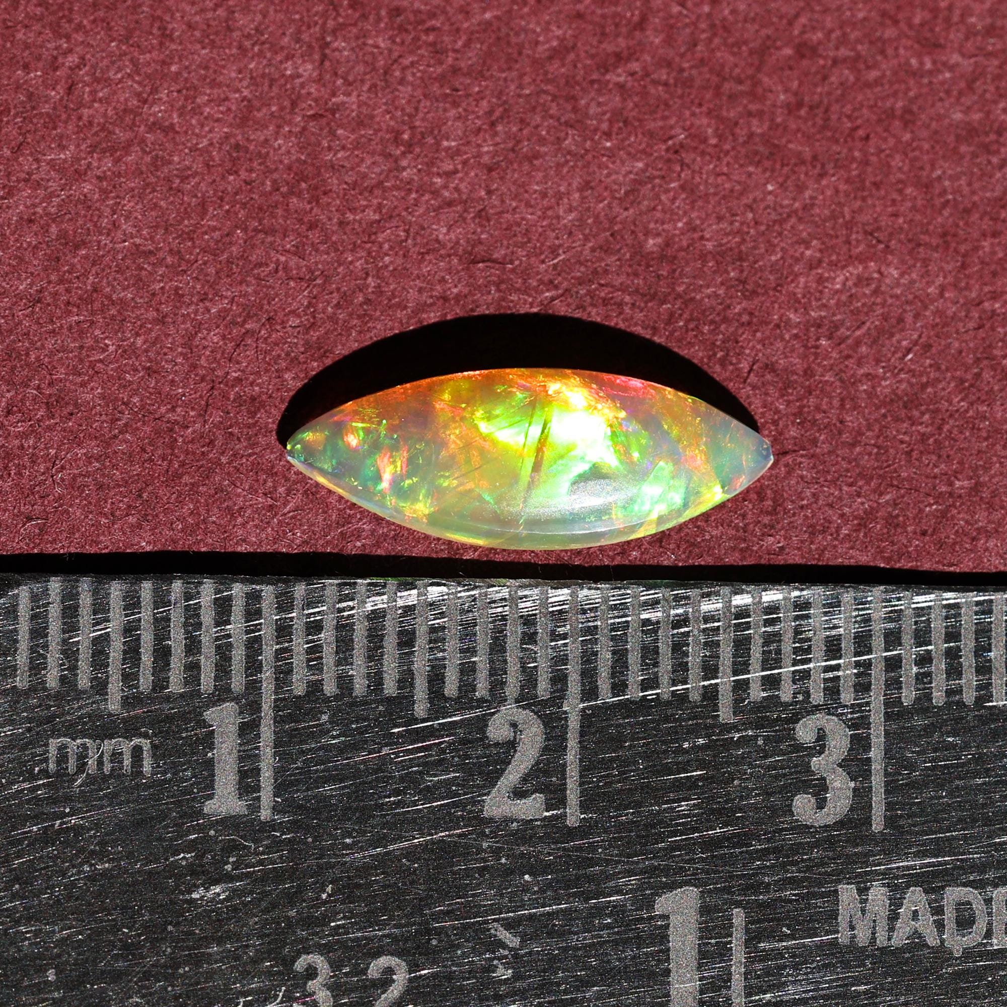 Milky White Ethiopian Opal Gemstone: 1.60 Carat Marquise Cabochon