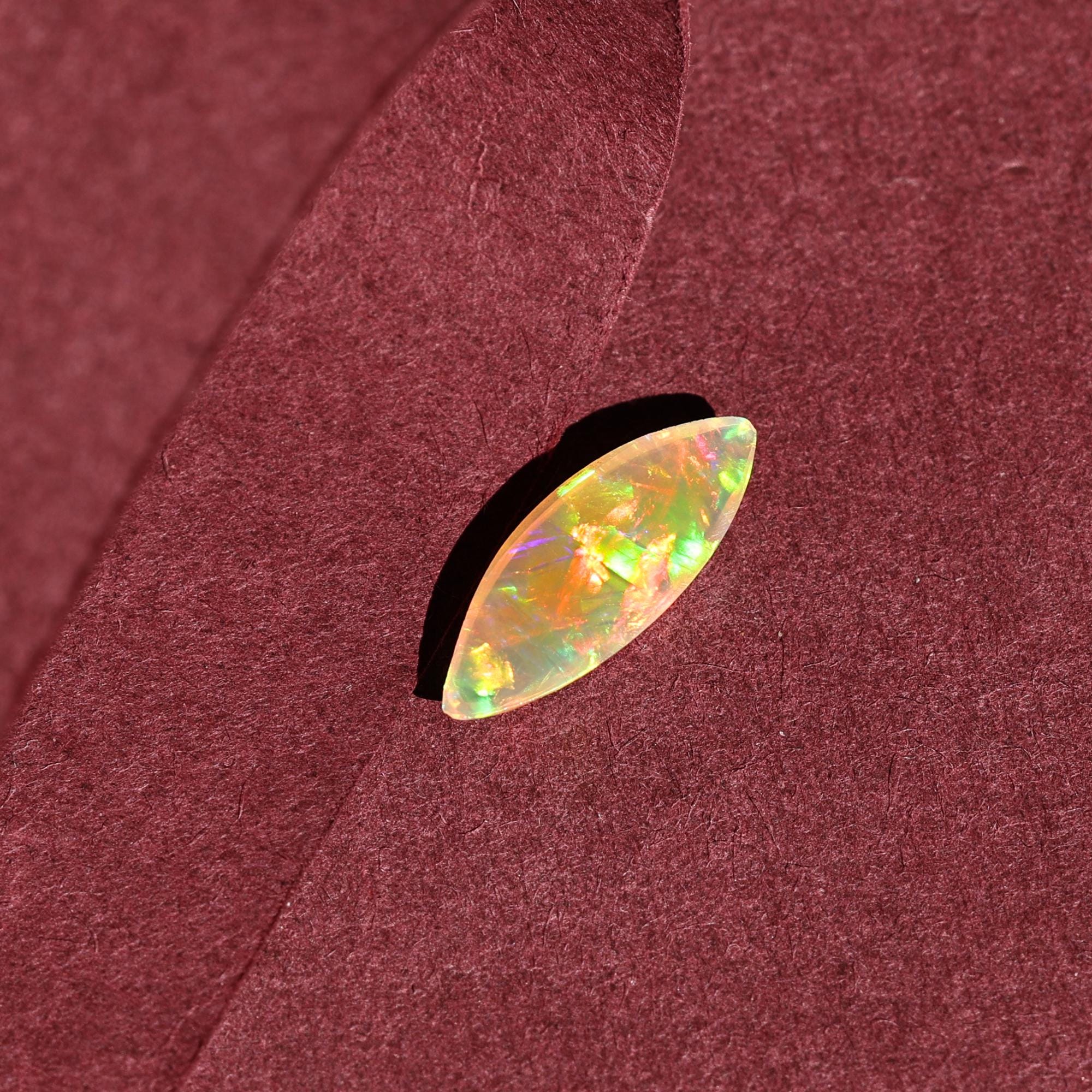 Milky White Ethiopian Opal Gemstone: 1.60 Carat Marquise Cabochon