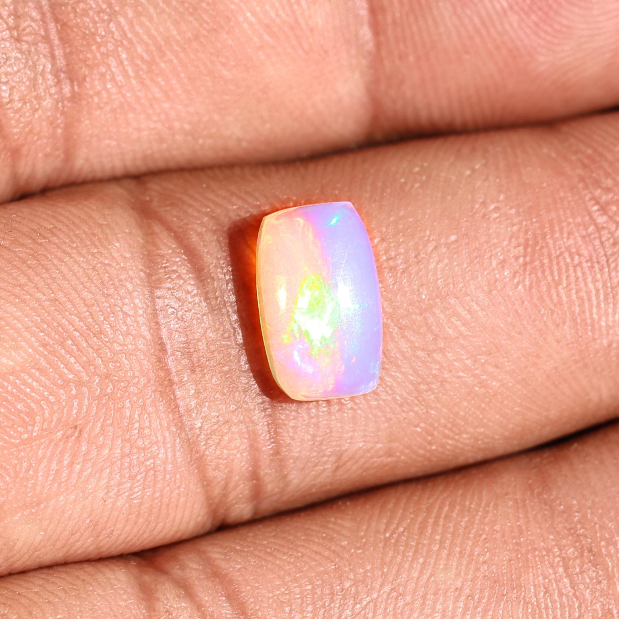 1.58 Carat Ethiopian Opal Gemstone: Rainbow Fire, Long Cushion Cabochon