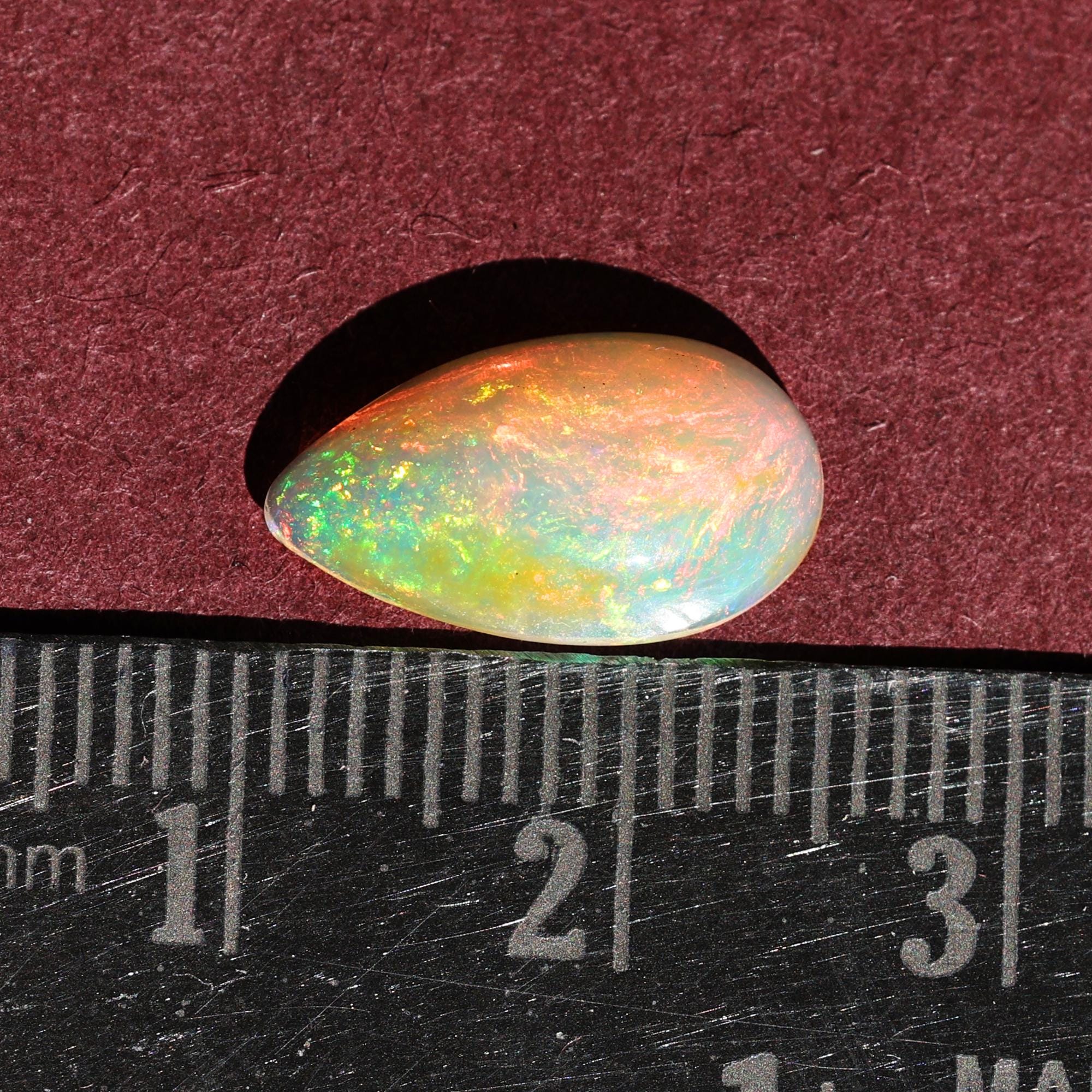 AAA+ Quality White Ethiopian Opal Cabochon: 2.25 Carat Pear-Shaped Gemstone
