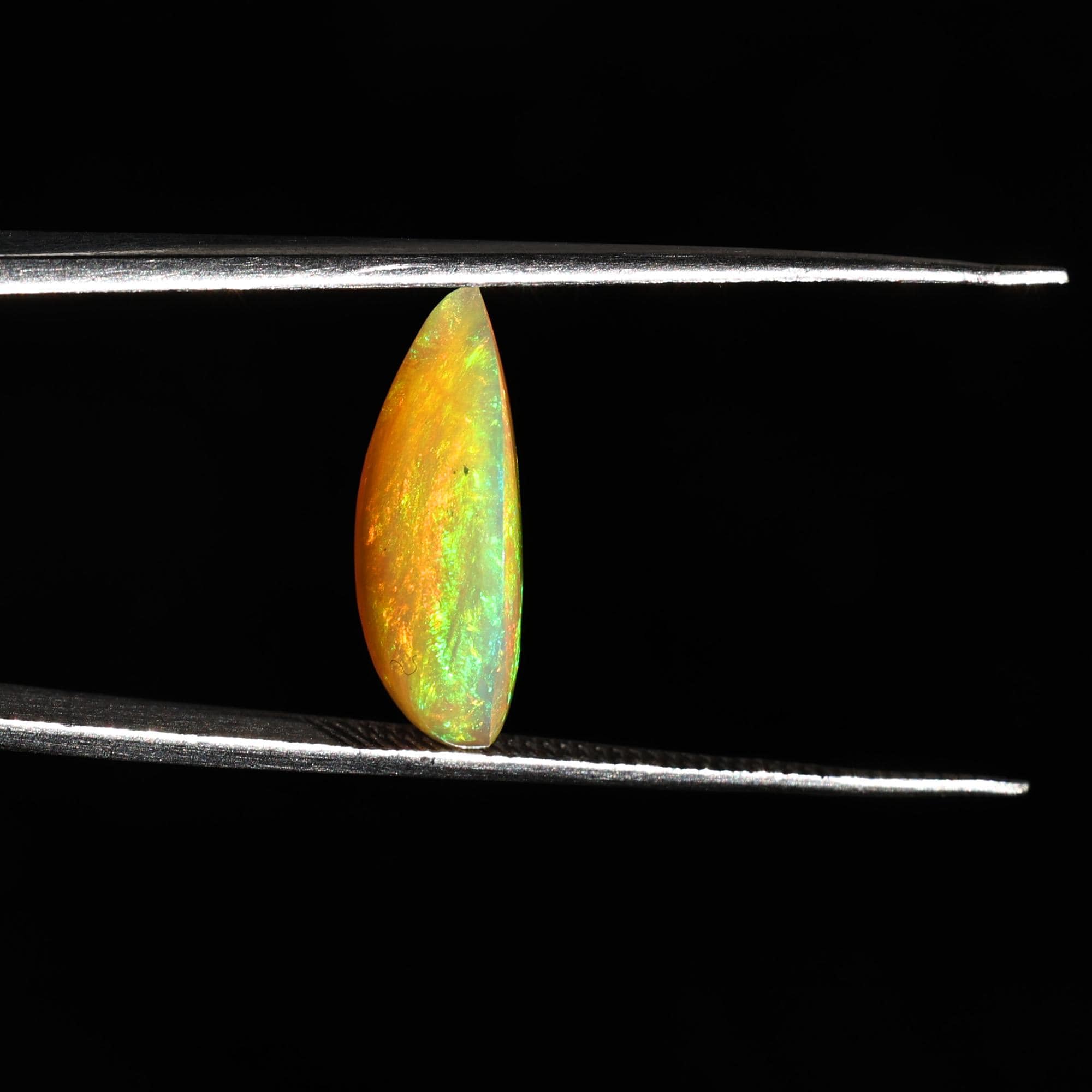 Natural AAA+ Grade White Ethiopian Opal Rainbow Fire Pear Shape Gemstones Wholesaler 4.15 Carat