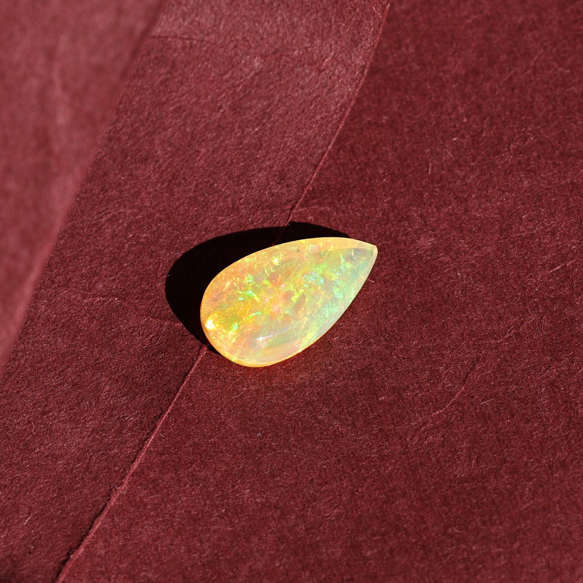 Natural AAA+ Grade White Ethiopian Opal Rainbow Fire Pear Shape Gemstones Wholesaler 4.15 Carat