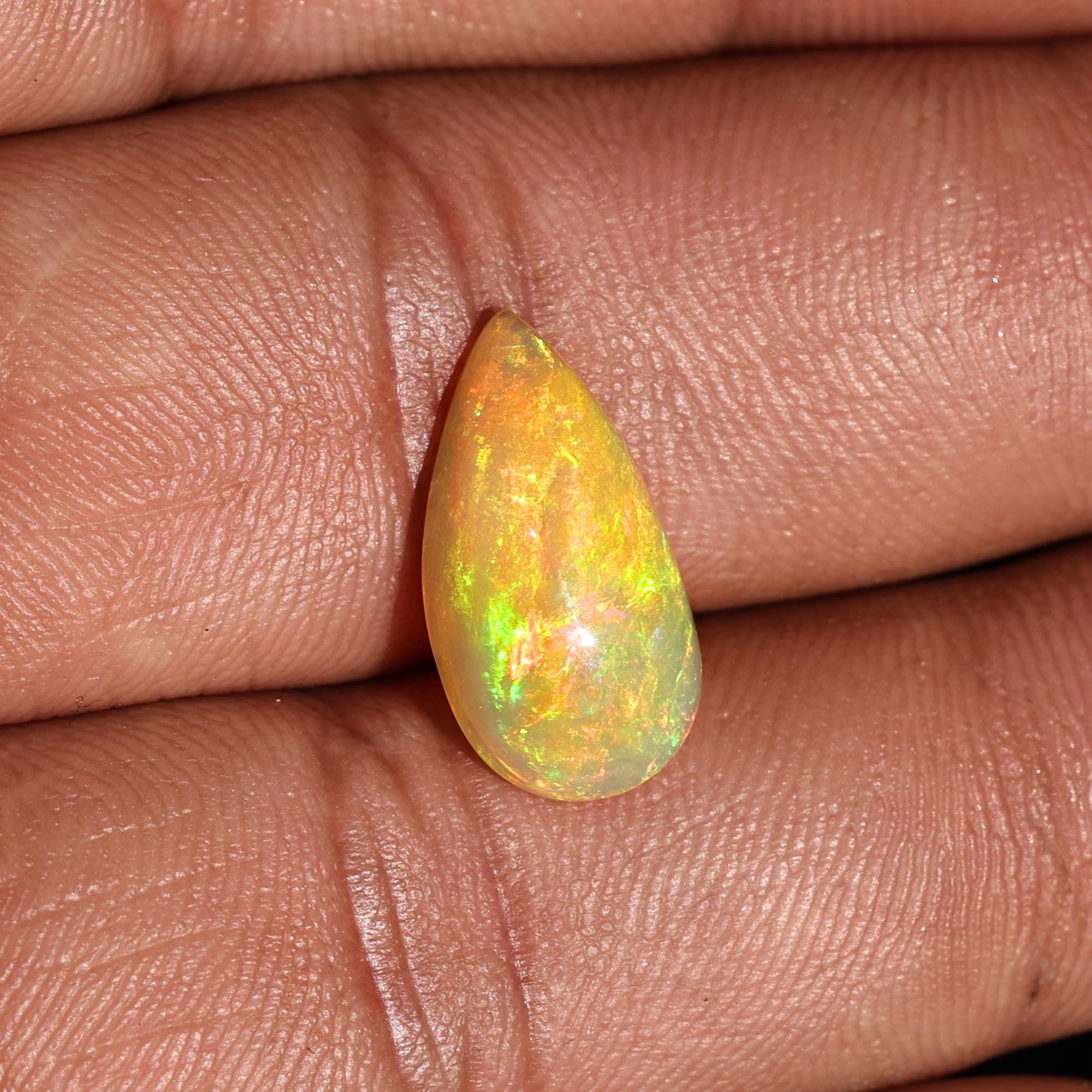 Natural AAA+ Grade White Ethiopian Opal Rainbow Fire Pear Shape Gemstones Wholesaler 4.15 Carat
