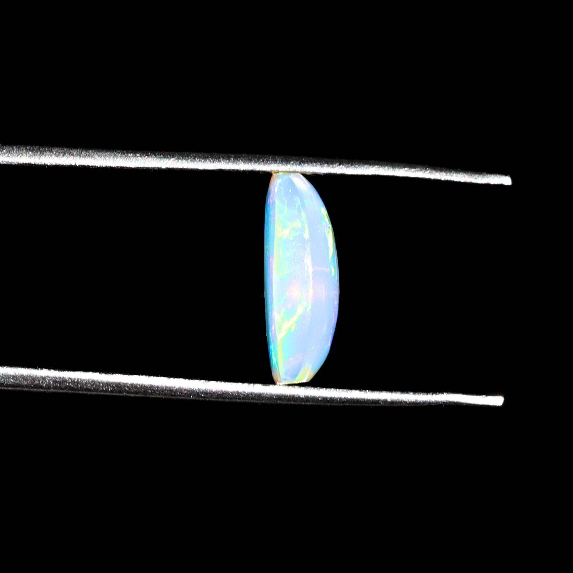 1.58 Carat Ethiopian Opal Gemstone: Rainbow Fire, Long Cushion Cabochon