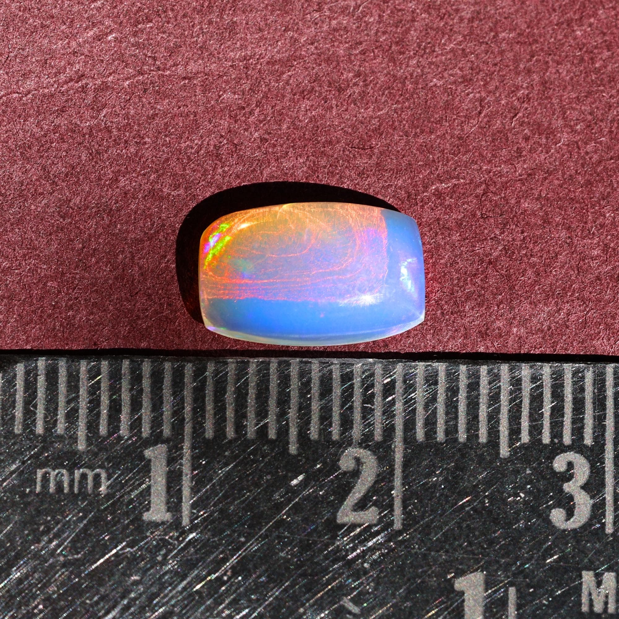 1.58 Carat Ethiopian Opal Gemstone: Rainbow Fire, Long Cushion Cabochon