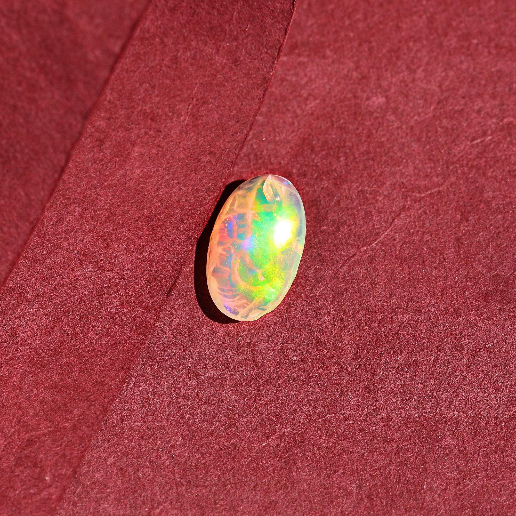 Ethiopian Opal Ganesha Carving: Oval Gemstone Statue (10x16mm)