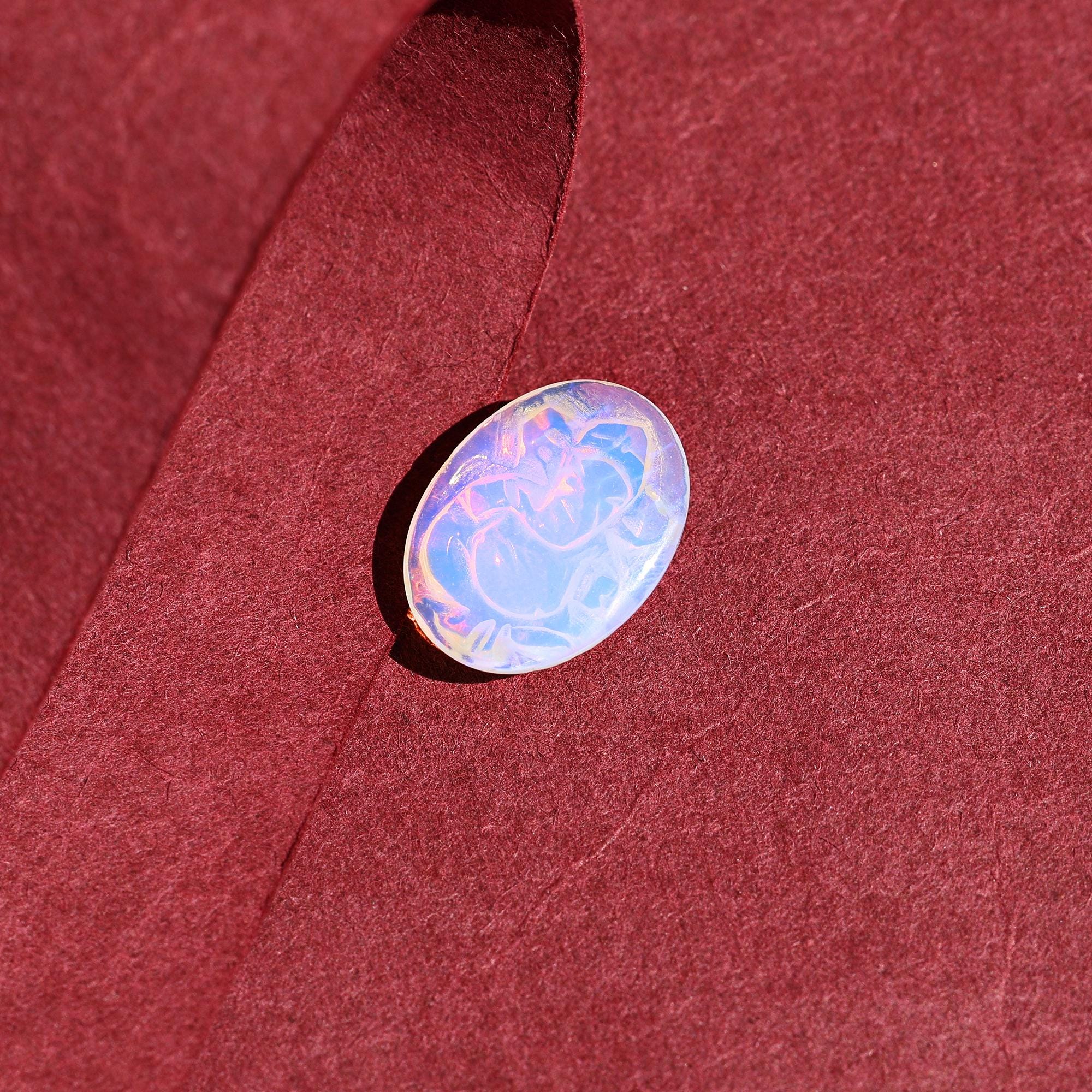 Ethiopian Opal Ganesha Carving: Divine Gemstone (12x16mm)