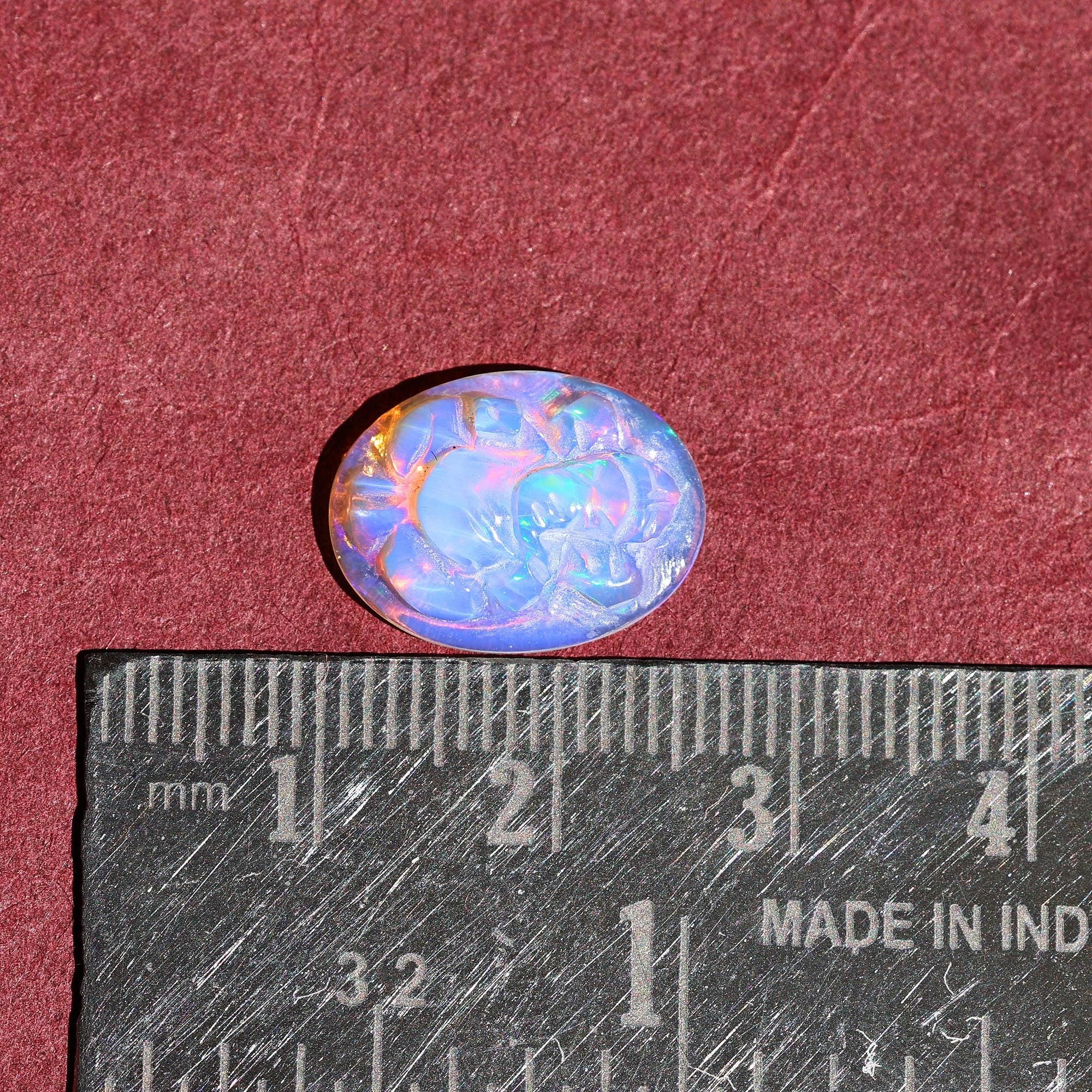 Ethiopian Opal Ganesha Carving: Divine Gemstone (12x16mm)