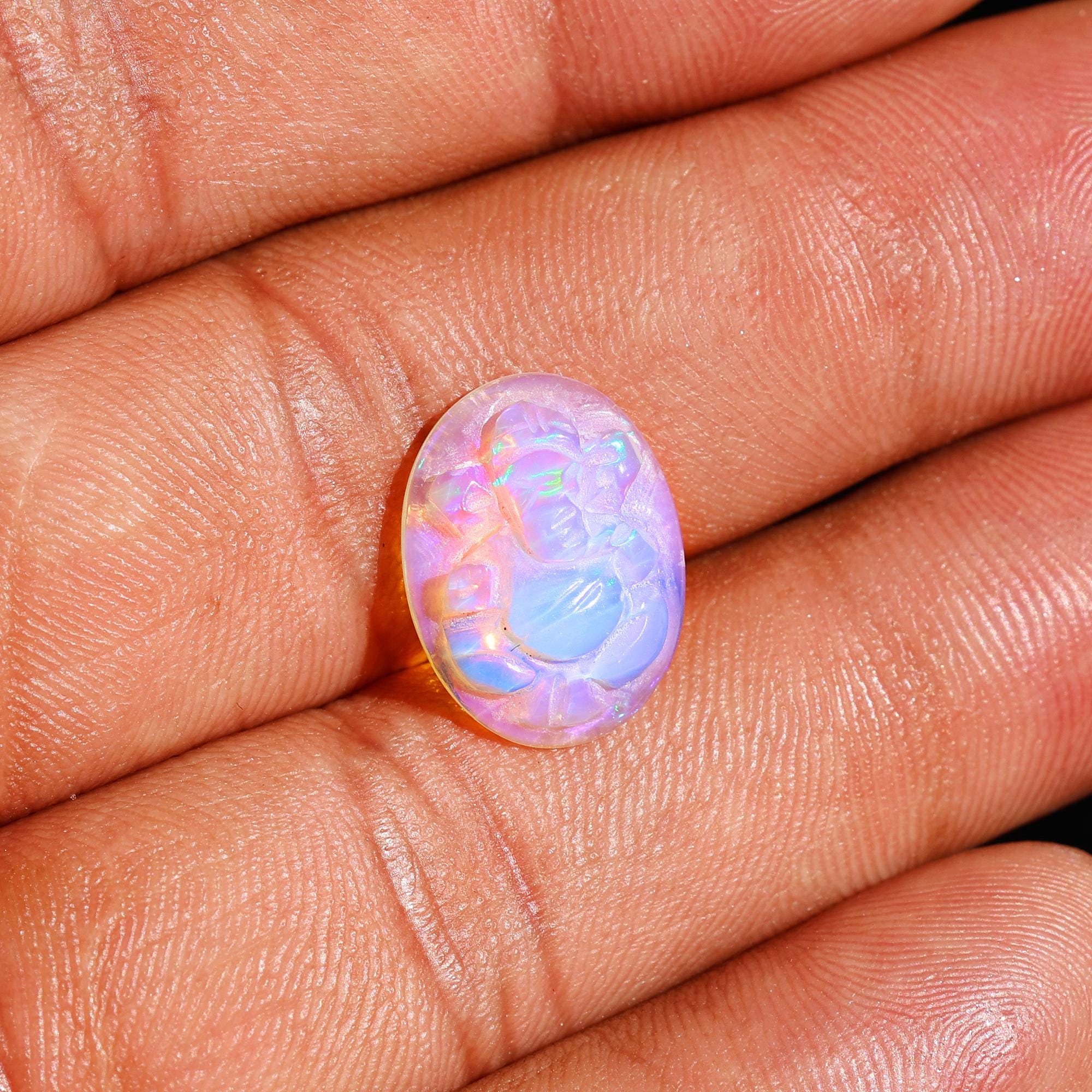 Ethiopian Opal Ganesha Carving: Divine Gemstone (12x16mm)