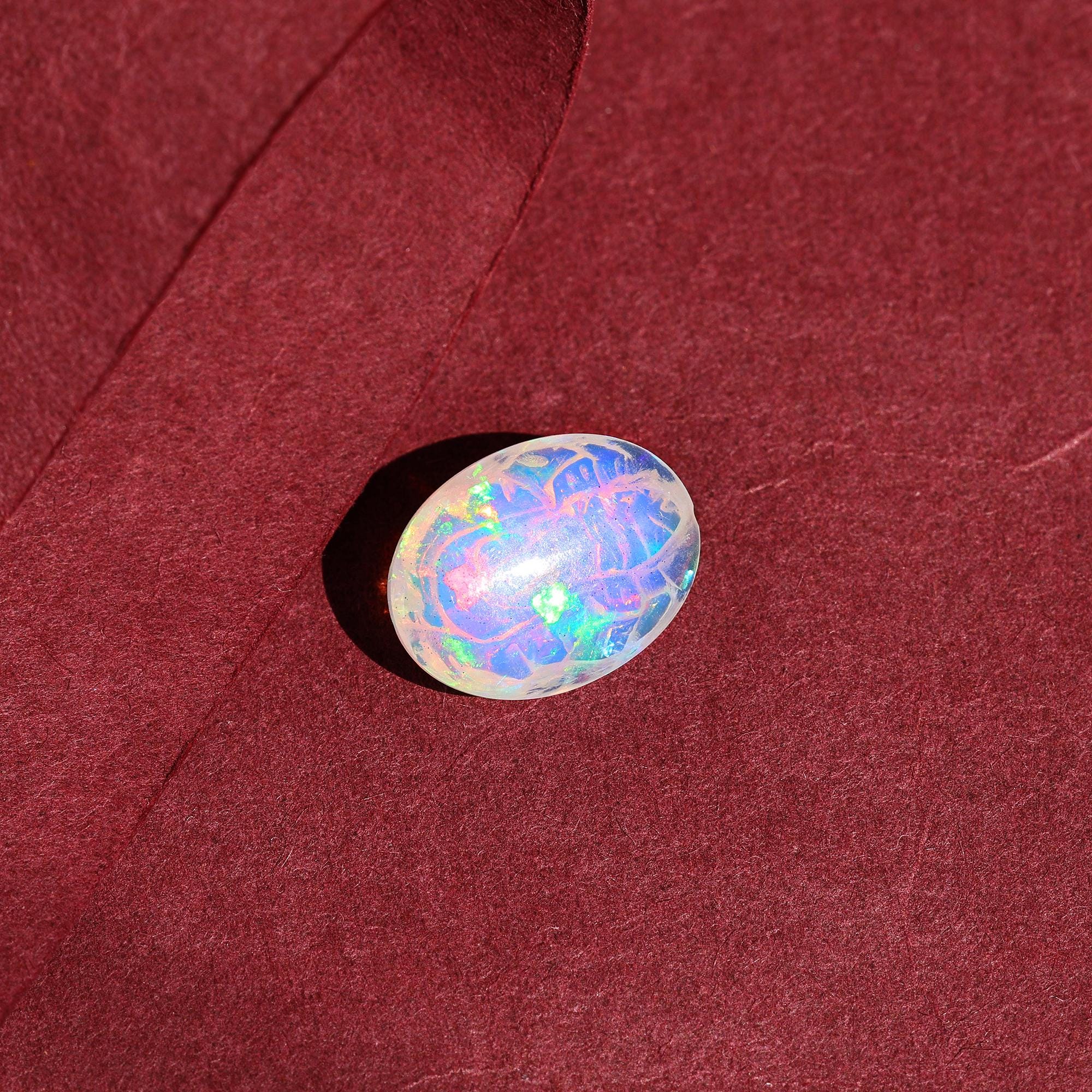 Ethiopian Opal Ganesha Carving: 5.20 Carat Welo Fire Gemstone (12x16mm)