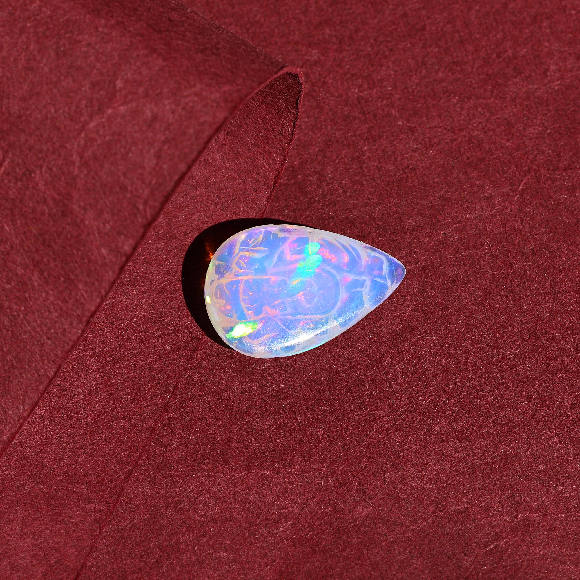 Carved Opal Ganesha: 4.70 Carat Pear-Shaped Gemstone