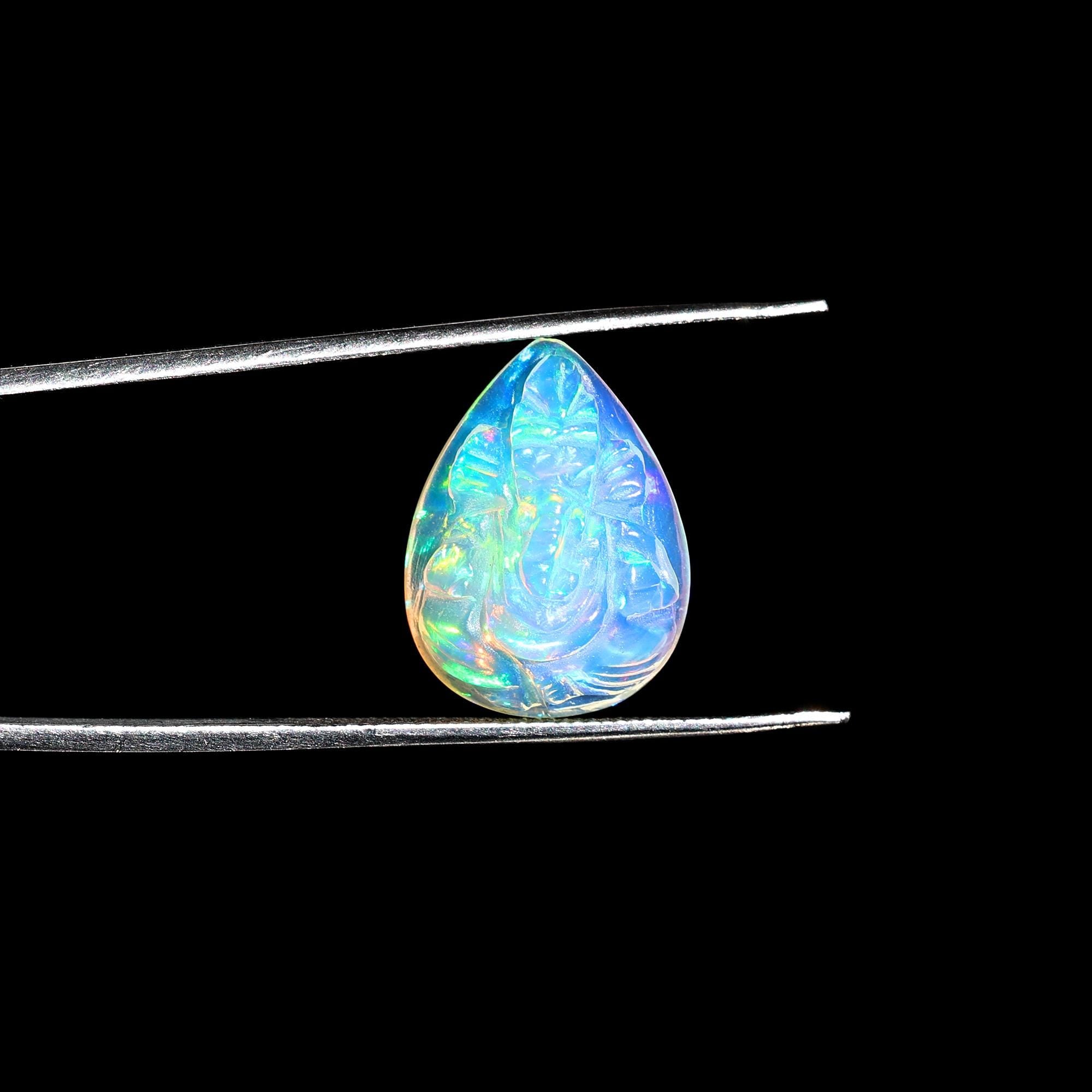 Hand-Carved Ethiopian Opal Ganesha Statue: Pear Shape Crystal Carving (5.60 Carat)