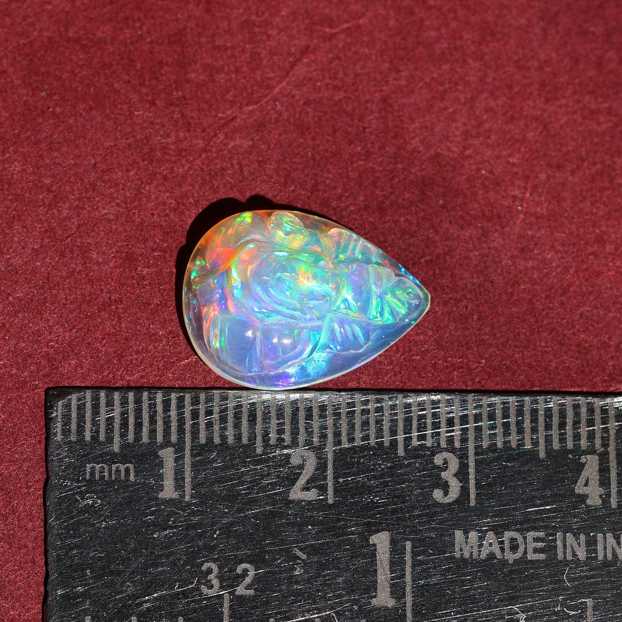 Hand-Carved Ethiopian Opal Ganesha Statue: Pear Shape Crystal Carving (5.60 Carat)