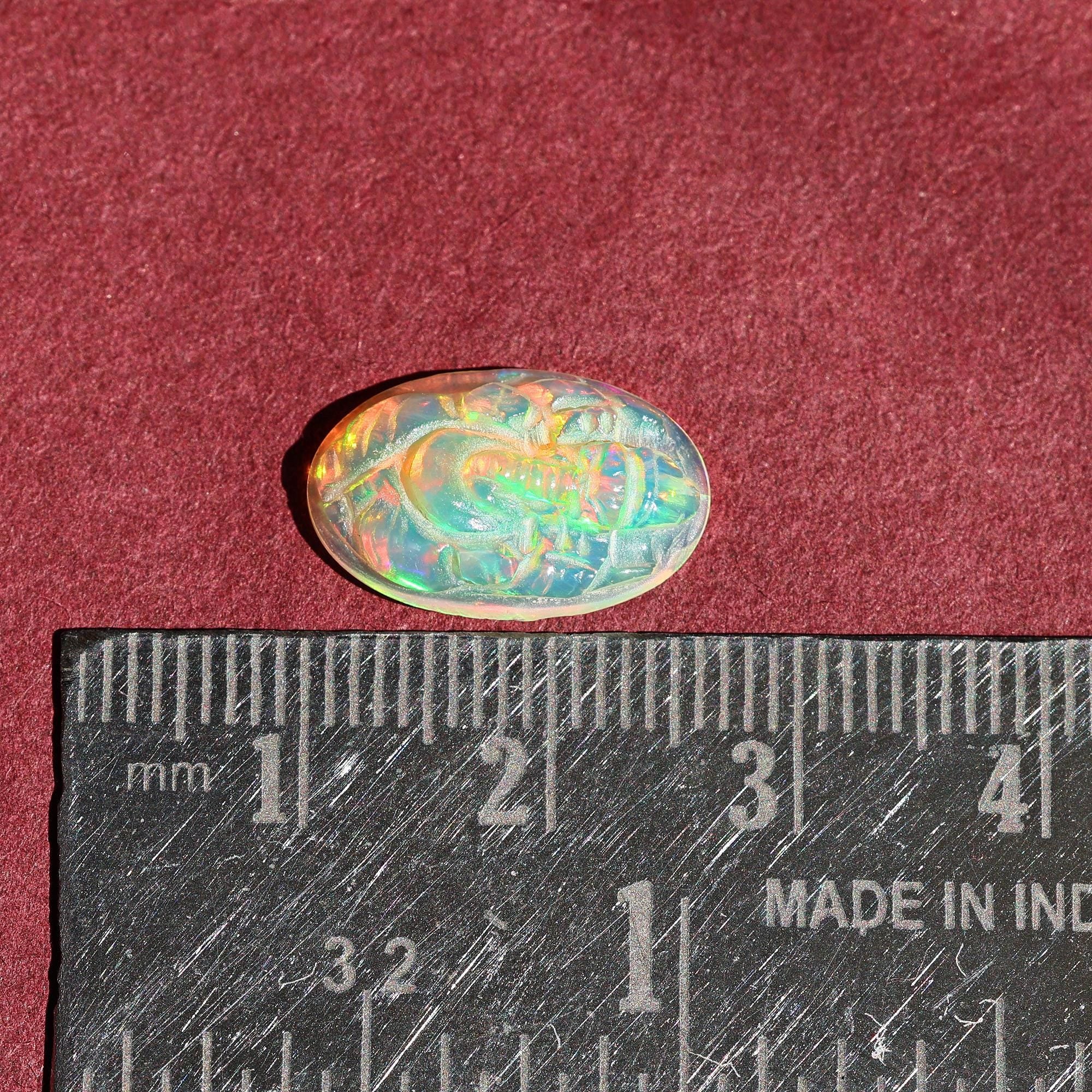 Ethiopian Opal Ganesha Carving: Oval Gemstone Statue (10x16mm)