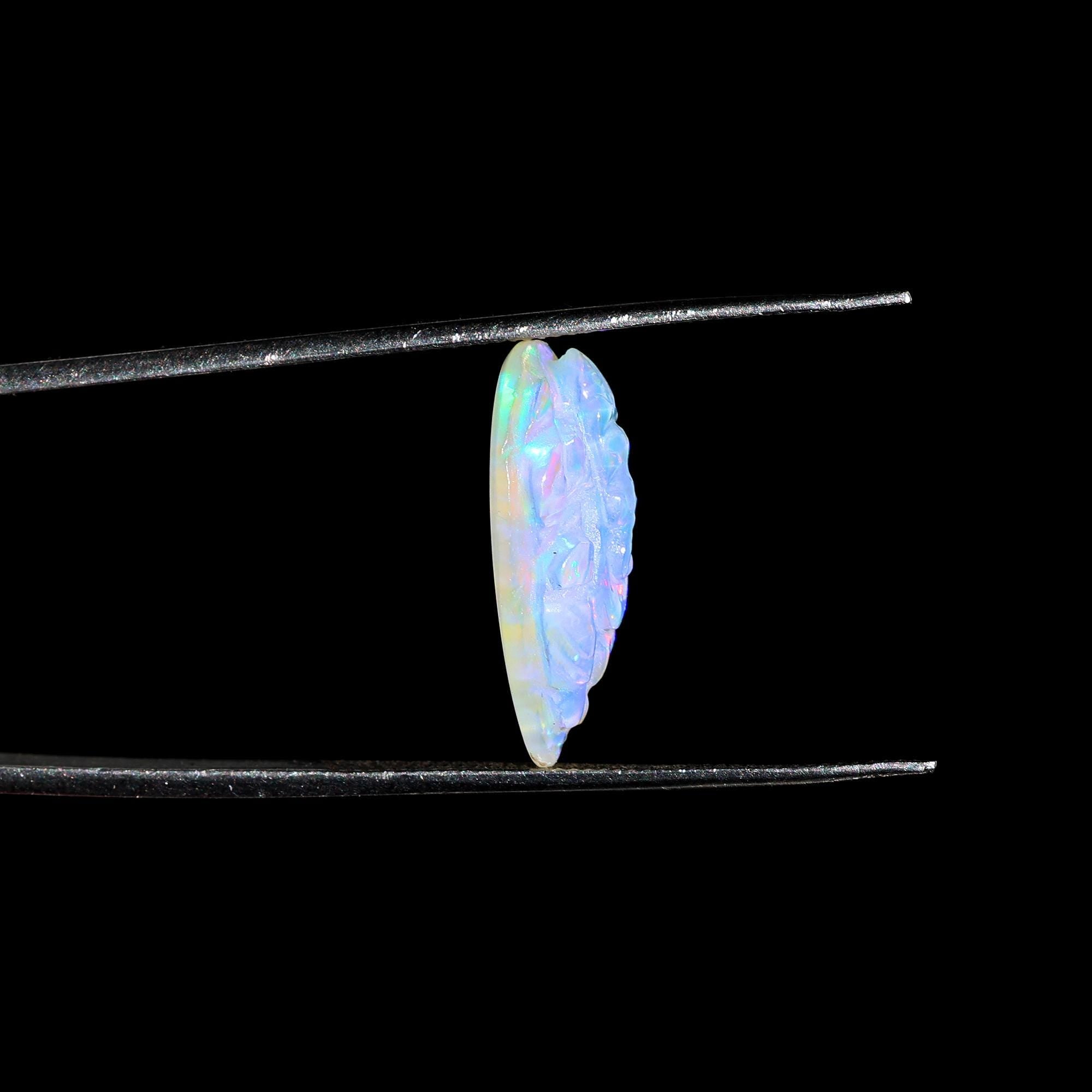 Carved Opal Ganesha: 4.70 Carat Pear-Shaped Gemstone