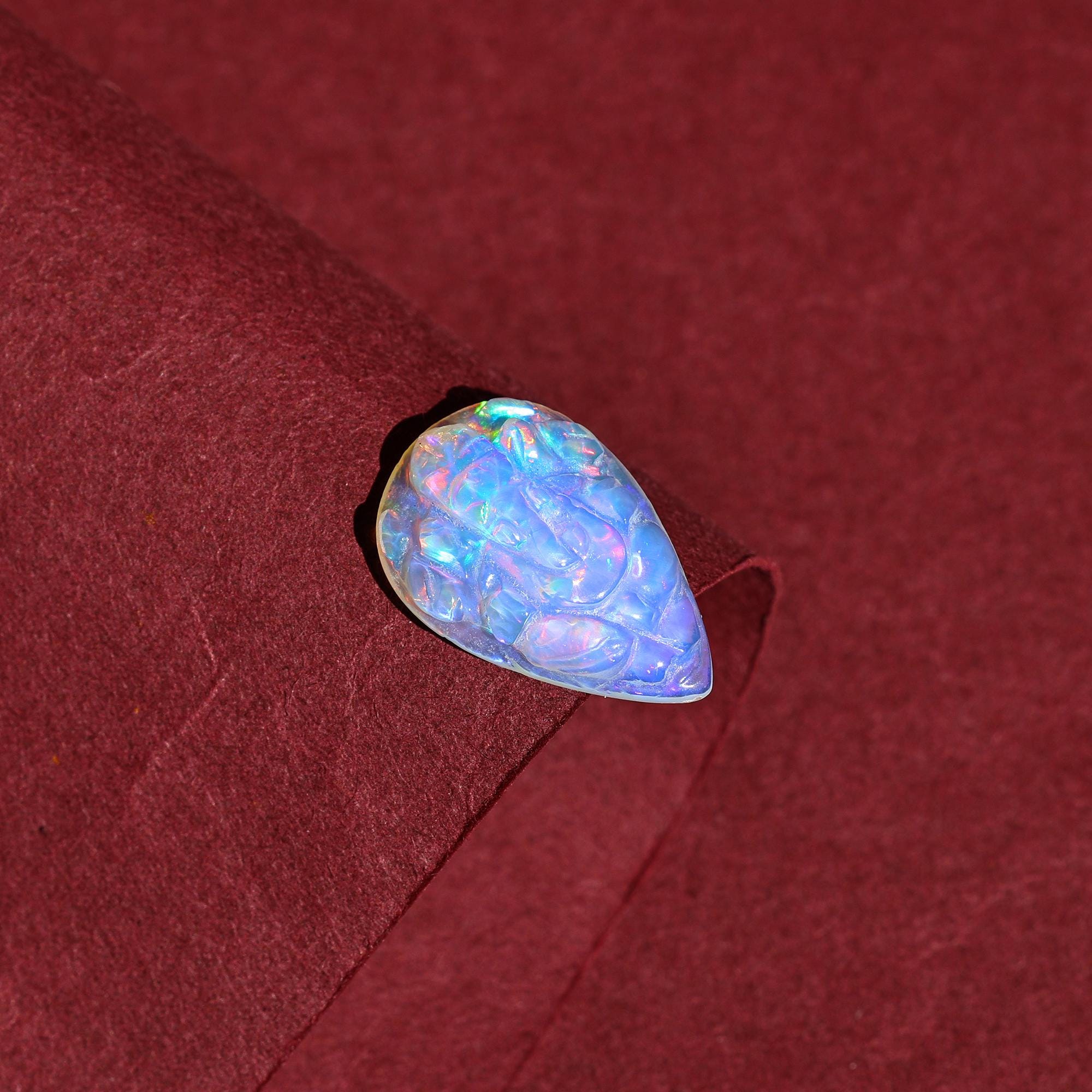 Carved Opal Ganesha: 4.70 Carat Pear-Shaped Gemstone