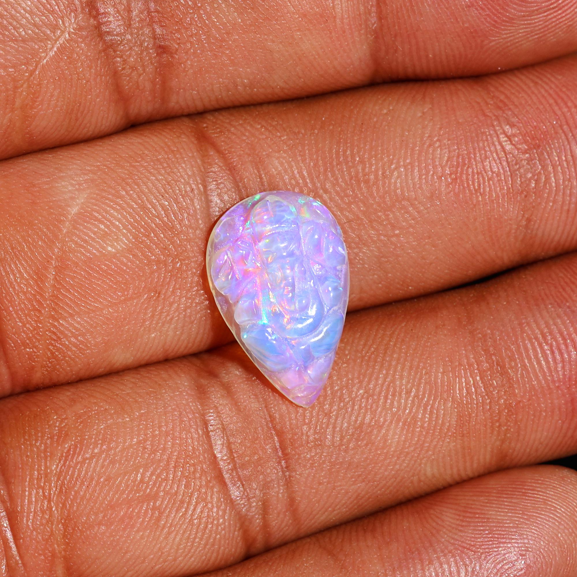 Carved Opal Ganesha: 4.70 Carat Pear-Shaped Gemstone