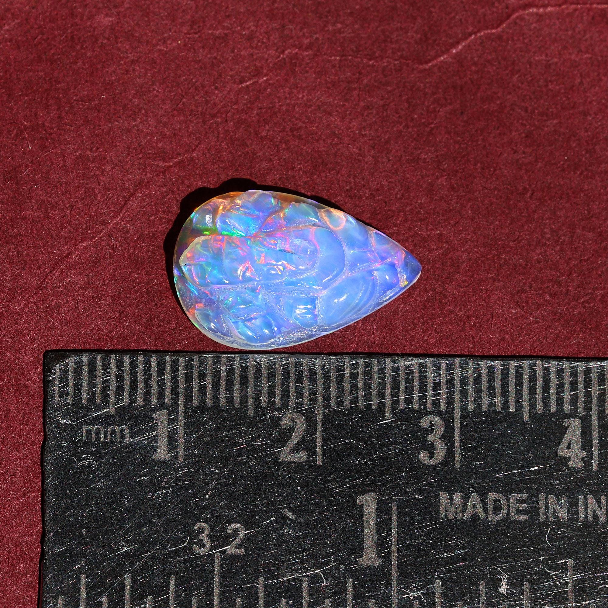 Carved Opal Ganesha: 4.70 Carat Pear-Shaped Gemstone