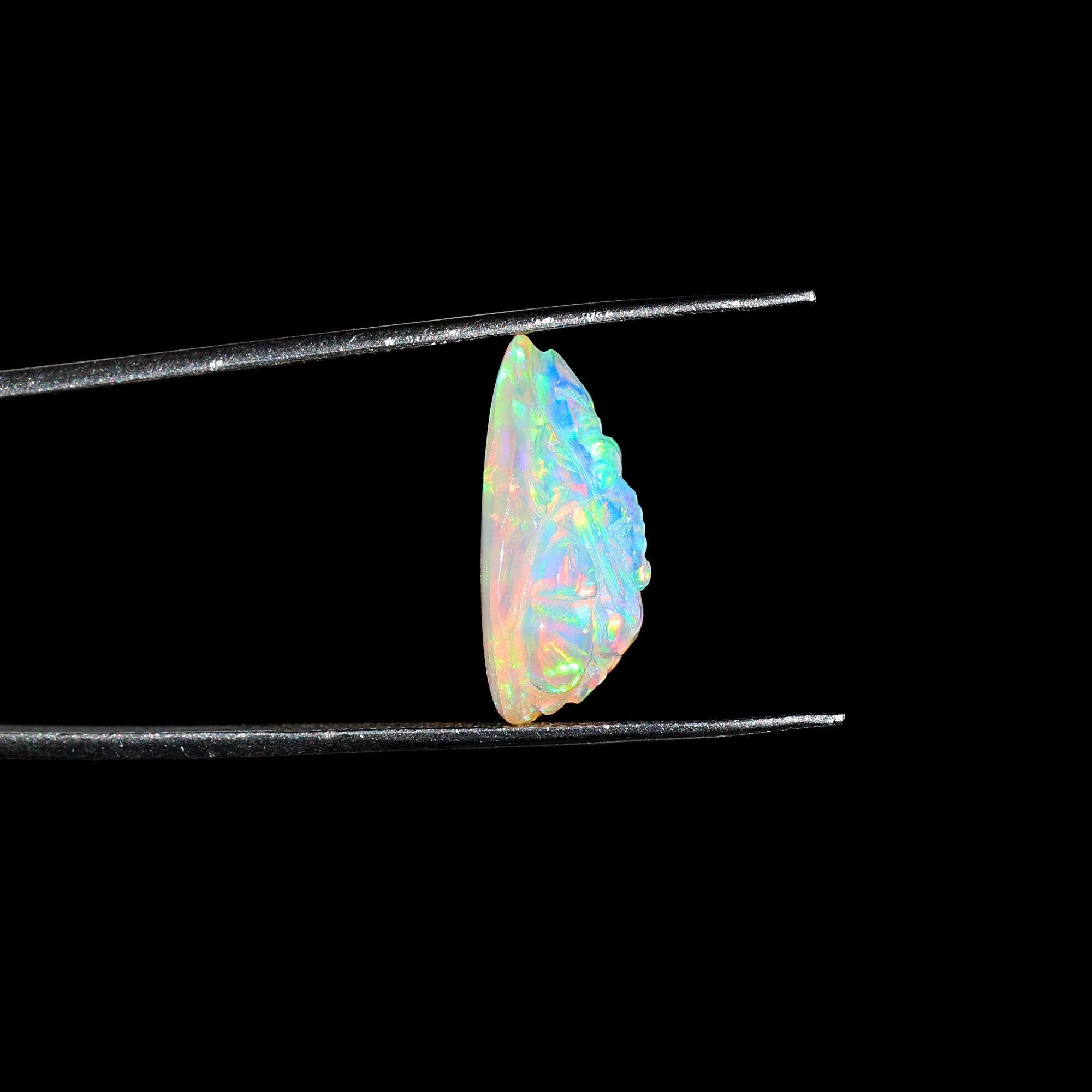 Hand-Carved Ethiopian Opal Ganesha Statue: Pear Shape Crystal Carving (5.60 Carat)