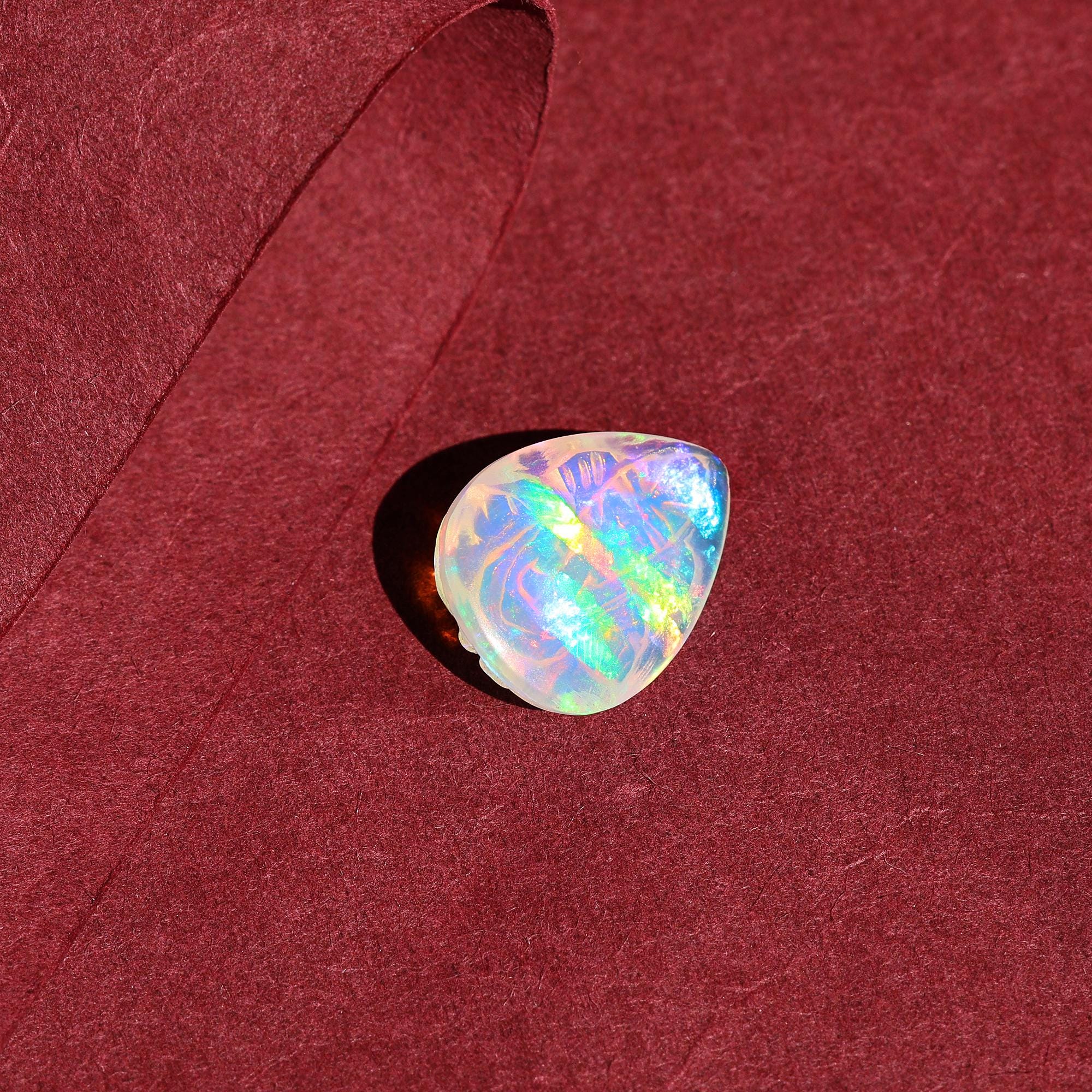 Hand-Carved Ethiopian Opal Ganesha Statue: Pear Shape Crystal Carving (5.60 Carat)