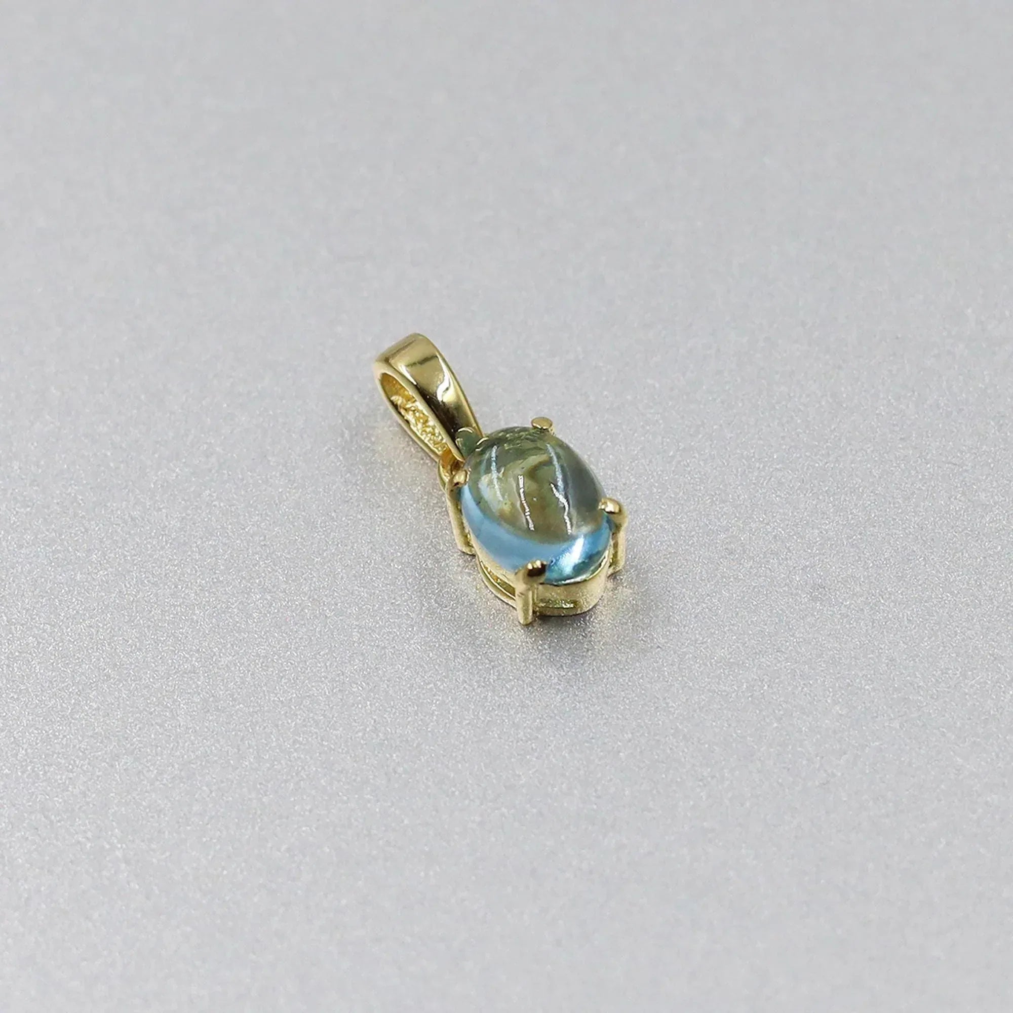 Swiss Blue Topaz Pendant: Oval Sterling Silver December Birthstone