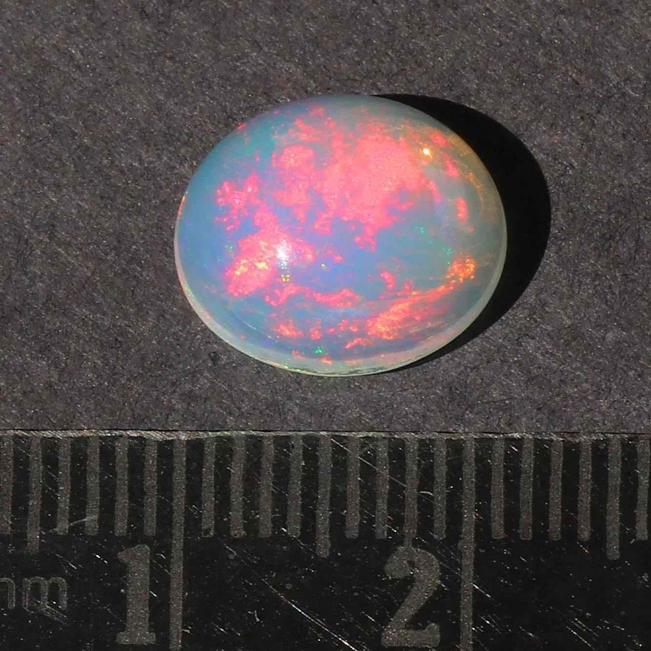 Ethiopian Opal Gemstone: 2.5 Ct Oval Cabochon Multi-Color Fire Play loose gemstones