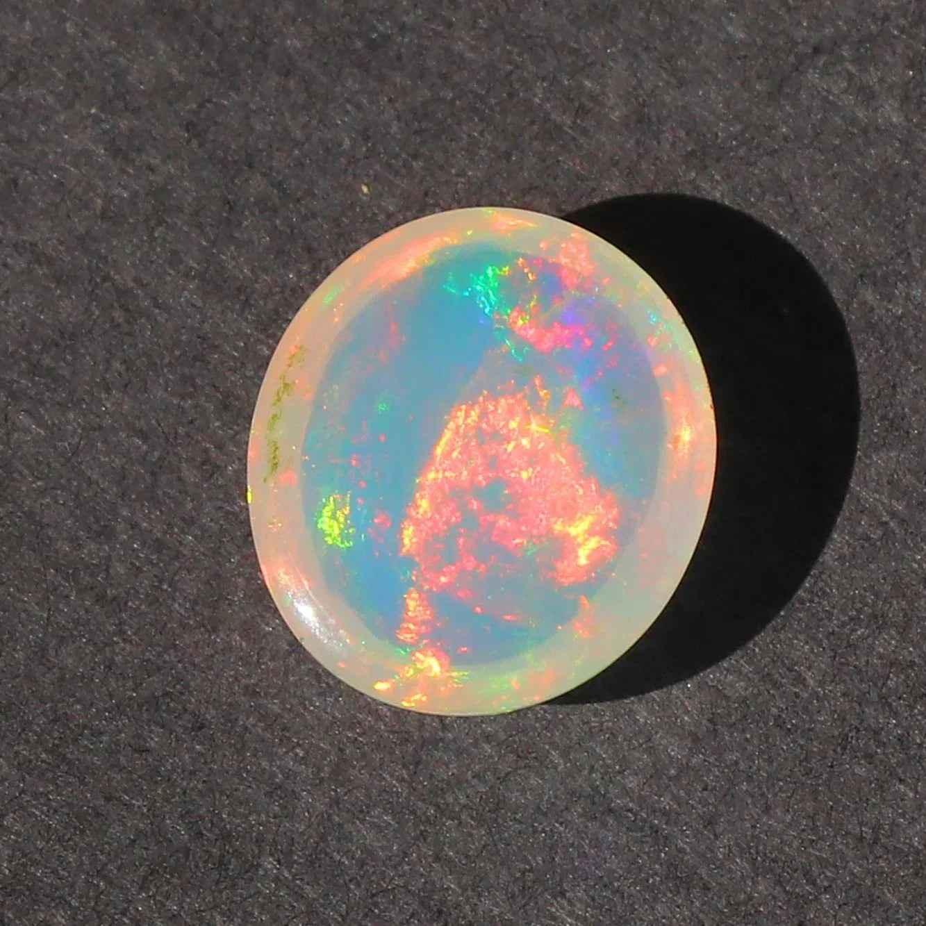 Ethiopian Opal Gemstone: 2.5 Ct Oval Cabochon Multi-Color Fire Play loose gemstones