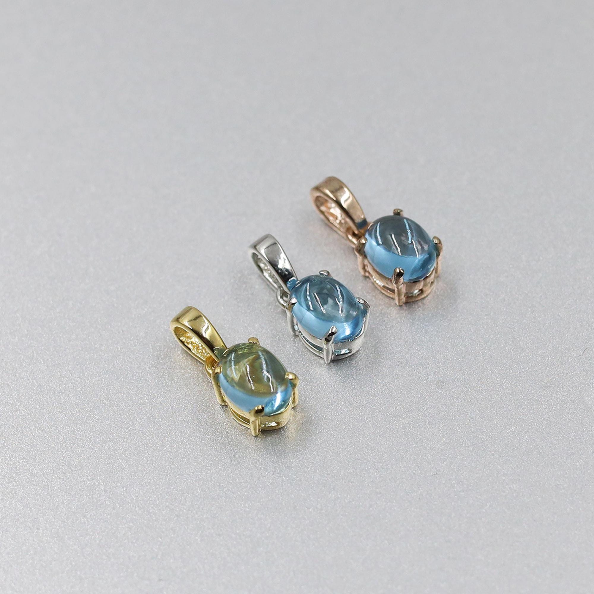 Swiss Blue Topaz Pendant: Oval Sterling Silver December Birthstone