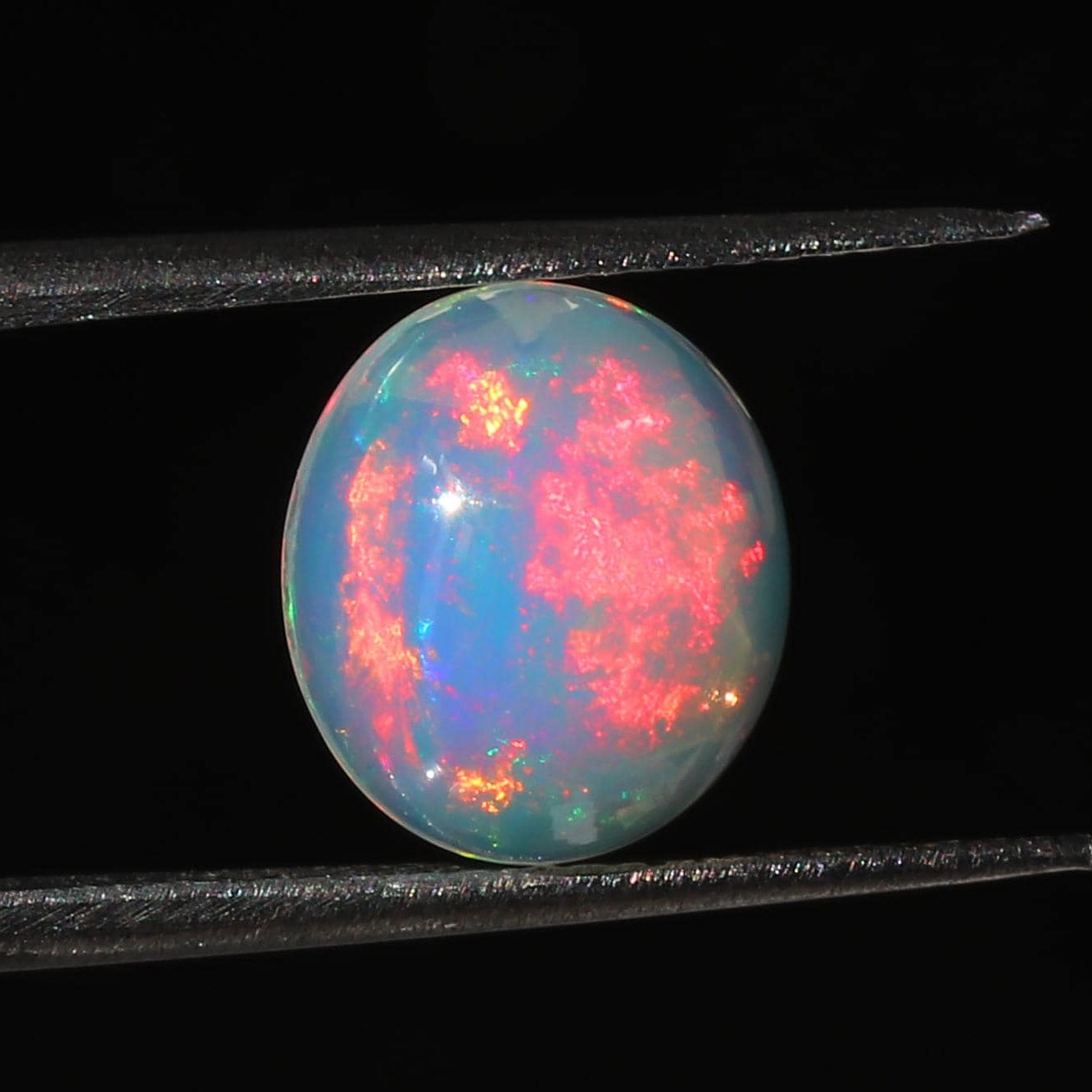Ethiopian Opal Gemstone: 2.5 Ct Oval Cabochon Multi-Color Fire Play