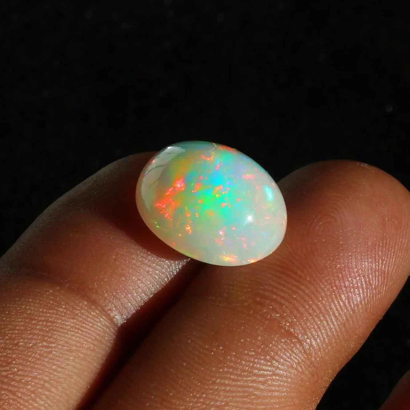 Ethiopian Opal Cabochon: 7.63 Carat Oval Fire Opal Gemstone loose gemstones
