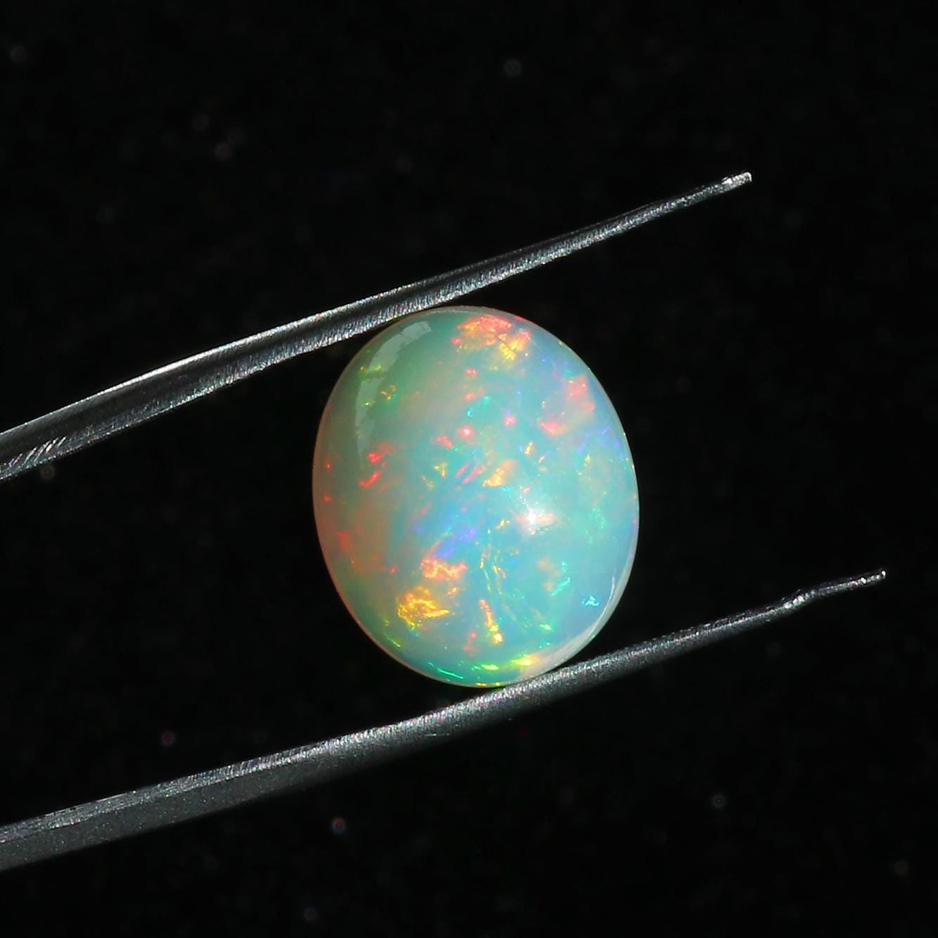 Ethiopian Opal Cabochon: 7.63 Carat Oval Fire Opal Gemstone
