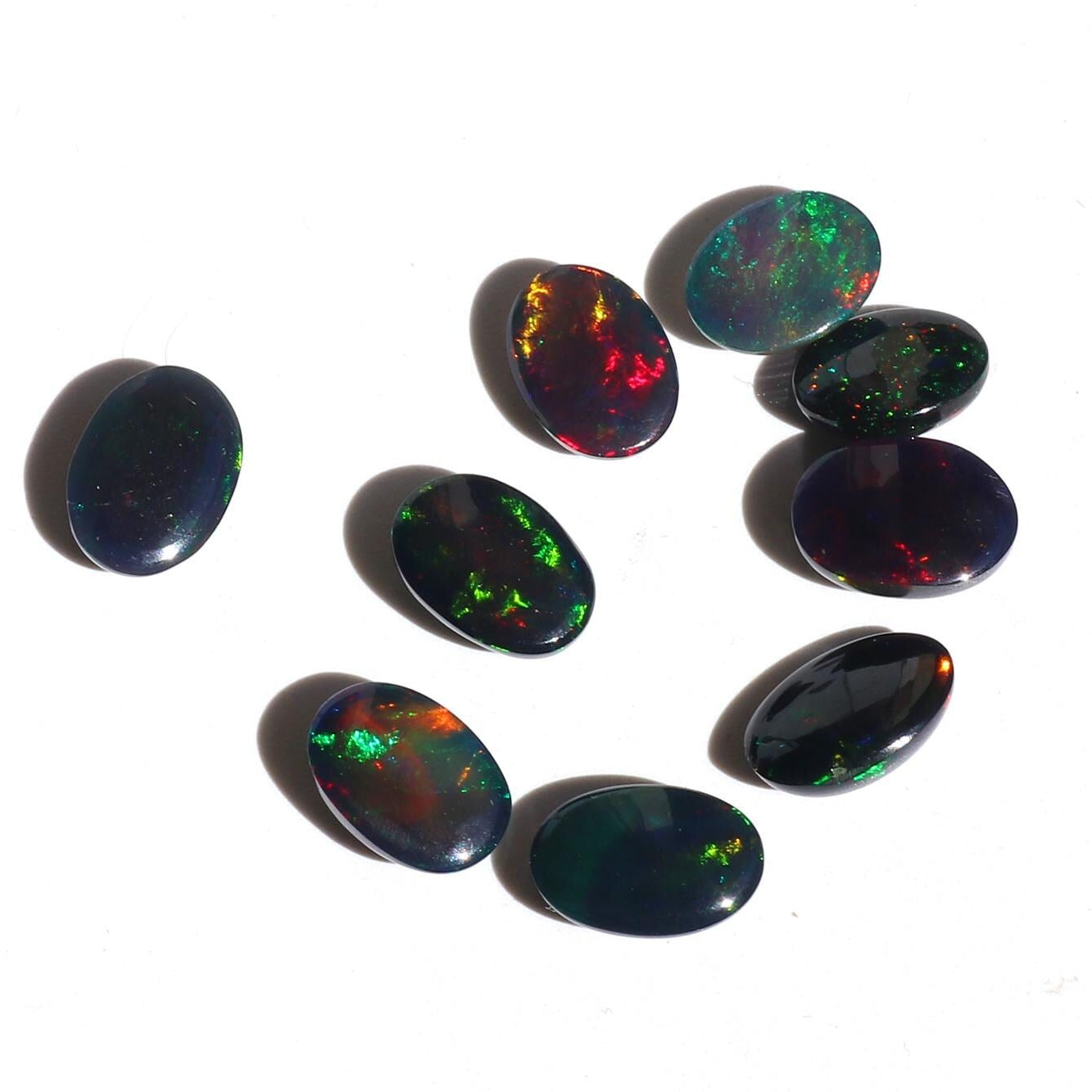 Ethiopian Black Opal Cabochons: Multi-Fire Gemstone Lot (11.53ct, 9pc, 7x10mm