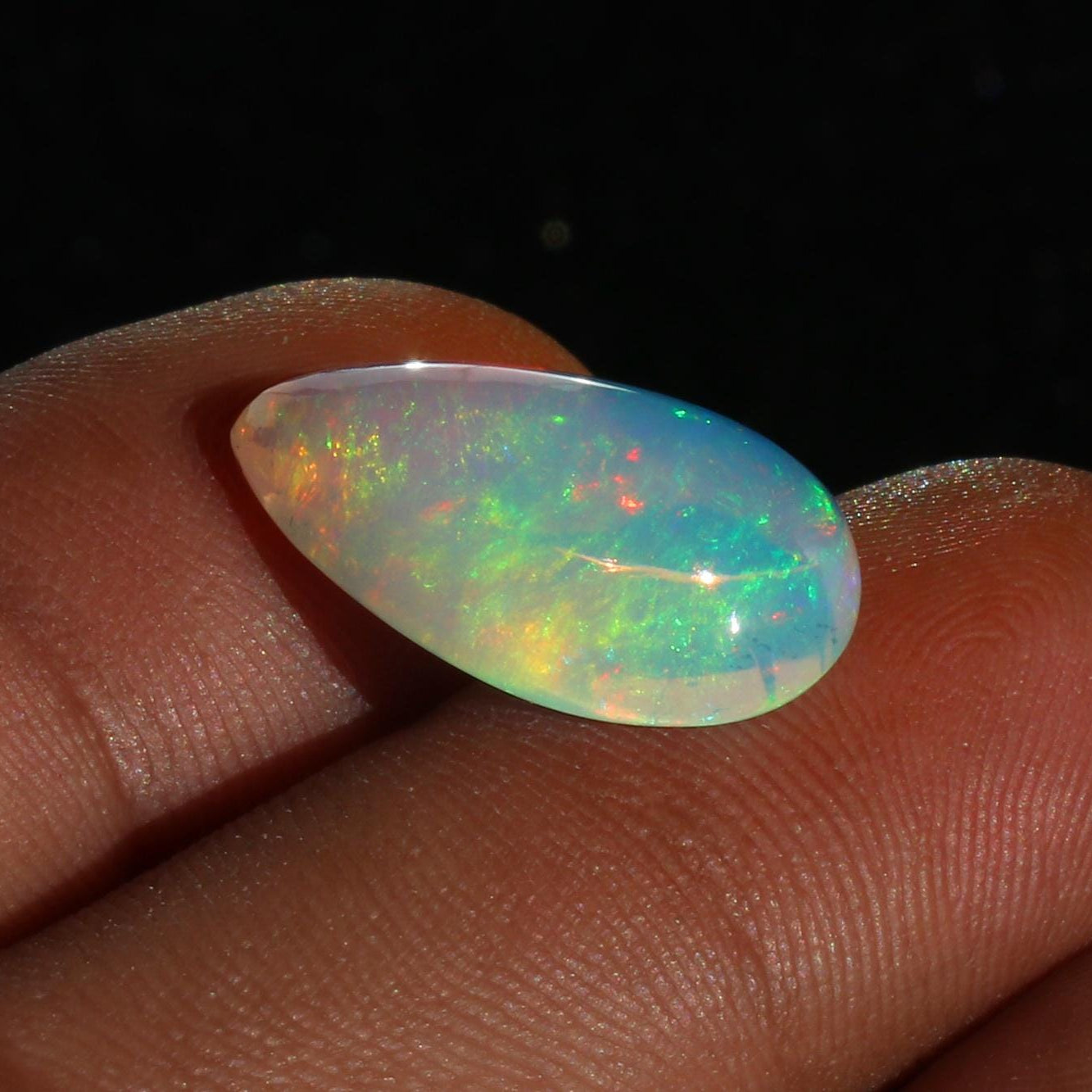 Ethiopian Welo Opal Cabochon: Rainbow Fire Pear-Shape Gemstone, 6.91 CT