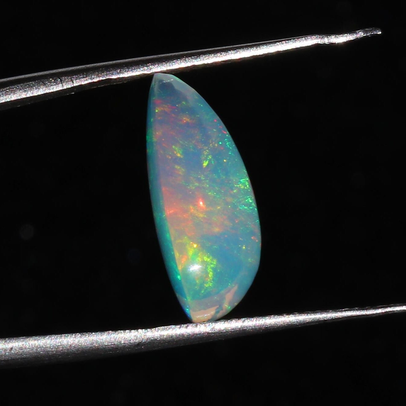 Ethiopian Welo Opal Cabochon: Rainbow Fire Pear-Cut Gemstone, 4.77 CT