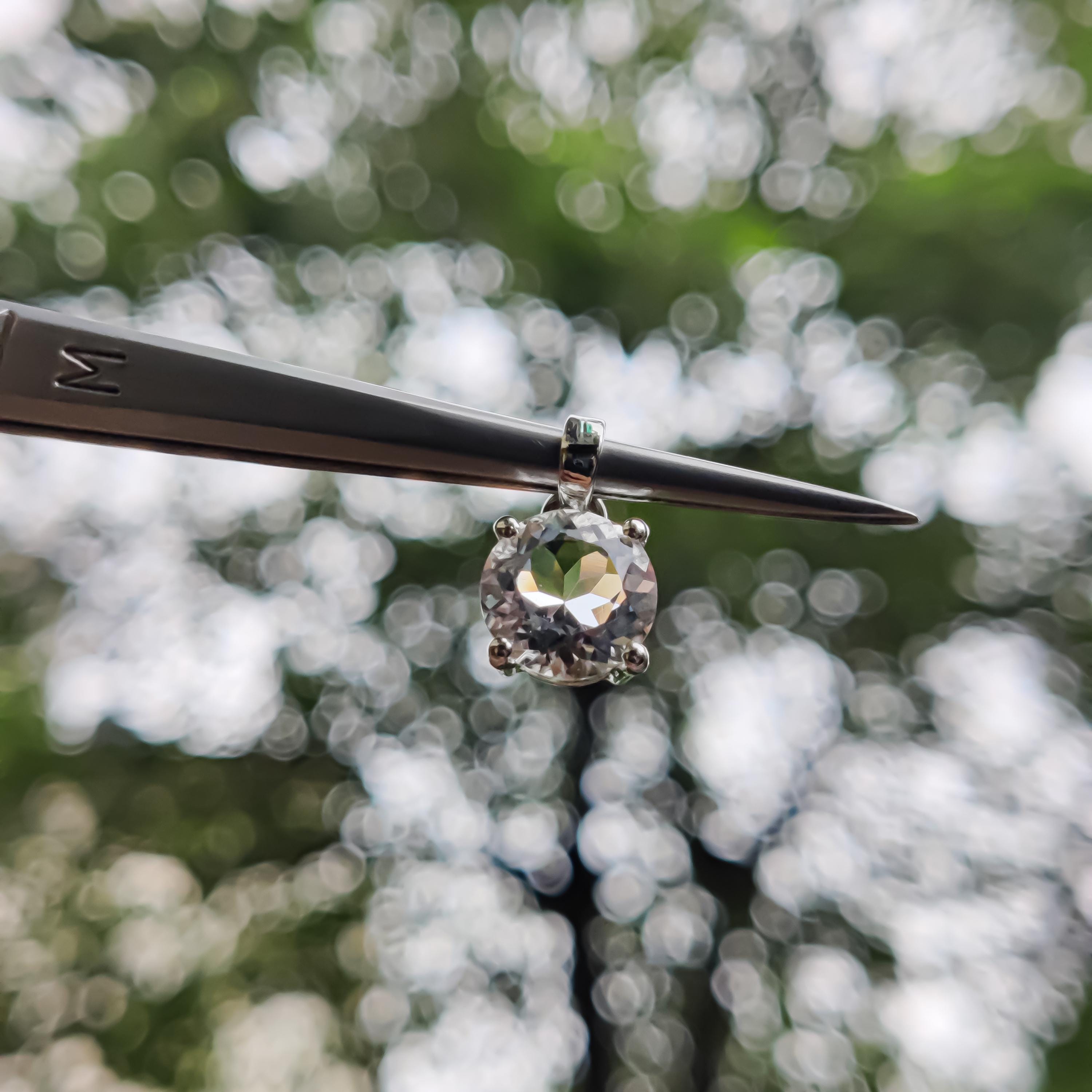 Sterling Silver Petalite Pendant – 9mm Faceted Round Gemstone