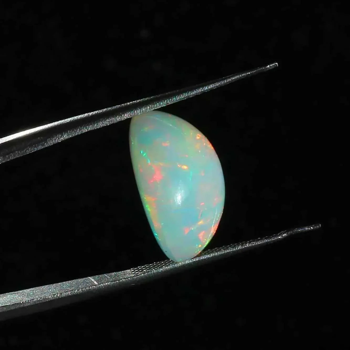 Ethiopian Opal Cabochon: 7.63 Carat Oval Fire Opal Gemstone loose gemstones