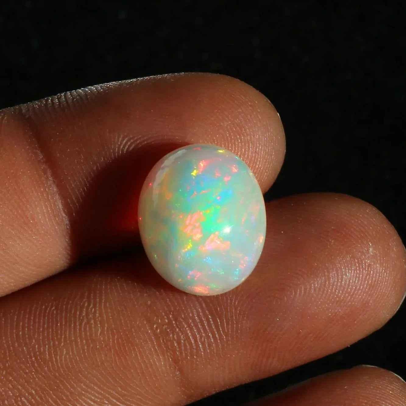 Ethiopian Opal Cabochon: 7.63 Carat Oval Fire Opal Gemstone loose gemstones