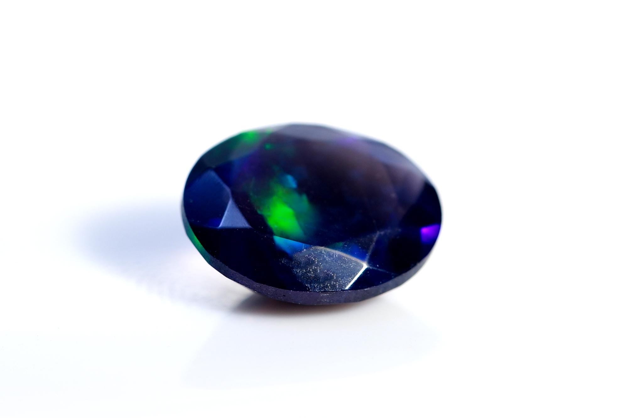 Ethiopian Welo Opal Gemstone: Faceted Black Oval Cut, 1.48 ct