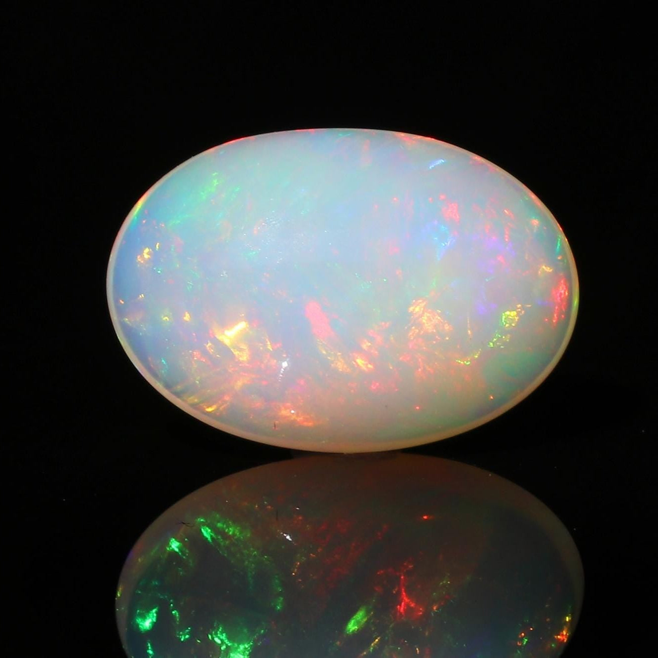 Welo Ethiopian Opal Gemstone: Oval Cabochon, October Birthstone