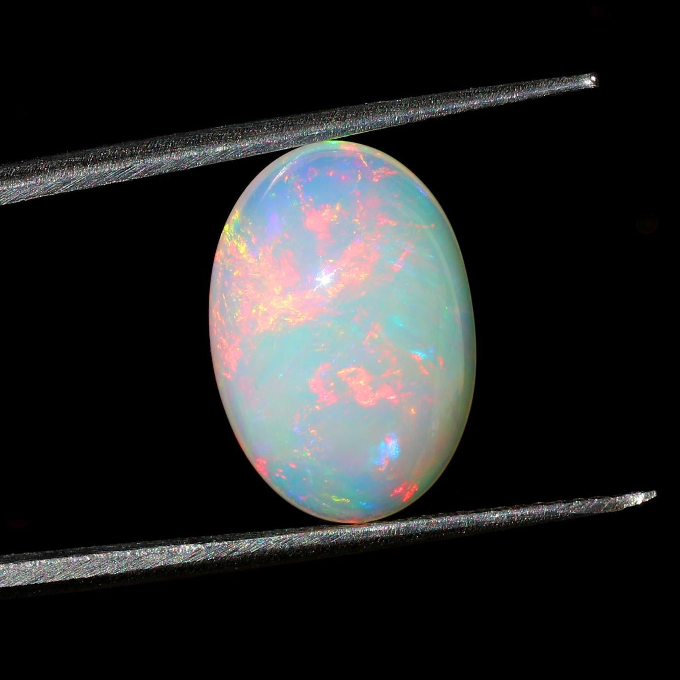 Welo Ethiopian Opal Gemstone: Oval Cabochon, October Birthstone